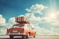 Retro car with a roof rack full of luggage on a backdrop of endless road ahead. Planning summer vacation Royalty Free Stock Photo