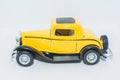 Retro car from the side. Beautiful classic yellow car. Nice antique auto