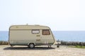 Retro caravan near the sea Royalty Free Stock Photo