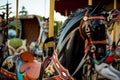 Retro carousel white, black horse. Old wooden horse carousel. Royalty Free Stock Photo