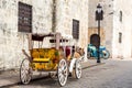 Retro carriage with a horse on a city street in Santo Domingo, Dominican Republic. Copy space for text. Royalty Free Stock Photo