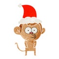 retro cartoon of a hooting monkey wearing santa hat Royalty Free Stock Photo