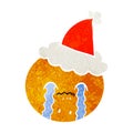 retro cartoon of a orange wearing santa hat