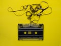 Retro cassette tape over yellow wooden table. top view. copy space Royalty Free Stock Photo