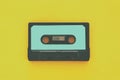 Retro cassette tape over yellow wooden table. top view. copy space Royalty Free Stock Photo