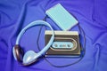 Retro cassette walkman on the blue fabric background