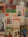 Retro chinese advertising poster from magazines glued on a wall