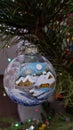 Glass Christmas ornament hand painted with winter landscape Royalty Free Stock Photo