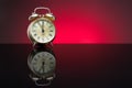 Retro clock, five to twelve, red background Royalty Free Stock Photo