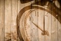 Retro clock on wood background selective focus at number 10 o`clock