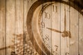 Retro clock on wood background selective focus at number 9 o`clock