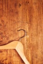 Retro cloth hanger on rustic wooden background, top view