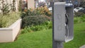 Retro coin-operated payphone station for emergency call on street, California USA. Public analog pay phone booth. Outdated Royalty Free Stock Photo