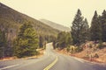 Retro color toned empty road, USA. Royalty Free Stock Photo