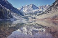 Retro color toned Maroon Bells mountain lake landscape, USA. Royalty Free Stock Photo