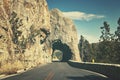 Retro color toned scenic rock tunnel in South Dakota, USA