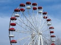 Retro colorful ferris wheel of the amusement park in the blue sky background. Royalty Free Stock Photo