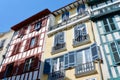 Retro colourful buildings with old fashioned windows and balconies on the street downtown Bayonne, Basque country, France Royalty Free Stock Photo