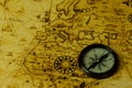 Retro compass on antique world map Royalty Free Stock Photo