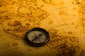 retro compass on antique world map Royalty Free Stock Photo