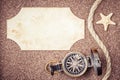 Retro compass on beach