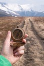 Retro compass in man hand Royalty Free Stock Photo