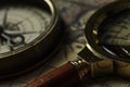 Retro compass with old map and magnifier Royalty Free Stock Photo