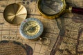 Retro compass with old map and magnifier Royalty Free Stock Photo