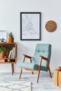 Retro composition of living room interior with mock up poster map, wooden shelf, book, armchair, plant, cacti, vinyl recorder.