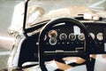 Retro convertible car with interesting dials and knobs on the dashboard Royalty Free Stock Photo