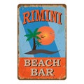 Rimini Beach bar retro damaged rusty sign board. Vintage advertisement for tropical cafe bar. Sun, summer and sea theme. Royalty Free Stock Photo