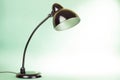 Retro desk lamp front mint green background