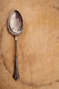 Retro dessert spoon on old wooden table Royalty Free Stock Photo