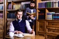 Retro detectives work on investigation and drink tea in room. Royalty Free Stock Photo