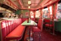 retro diner booth with milkshakes on the table