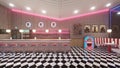 Retro diner interior with a tile floor, neon illumination, jukebox and art deco style bar stools. 3d illustration