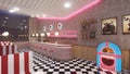 Retro diner interior with a tile floor, neon illumination, jukebox and art deco style bar stools. 3d illustration Royalty Free Stock Photo