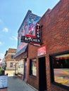 Retro Diner Sign with Octopus Mural and Pride Flags, Urban Street Scene