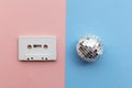 Retro disco glitter ball with a vintage cassette tape