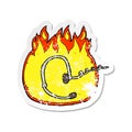 retro distressed sticker of a burning headset cartoon