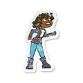 retro distressed sticker of a cartoon angry biker girl