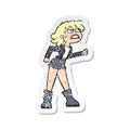 retro distressed sticker of a cartoon angry biker girl