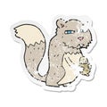 retro distressed sticker of a cartoon angry squirrel with nut Royalty Free Stock Photo