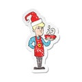 retro distressed sticker of a cartoon barista serving coffee at christmas