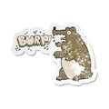 retro distressed sticker of a cartoon bear burping