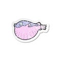 retro distressed sticker of a cartoon blowfish