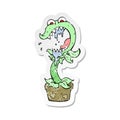 retro distressed sticker of a cartoon carnivorous plant