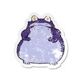 retro distressed sticker of a cartoon fat frog Royalty Free Stock Photo
