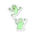 retro distressed sticker of a cartoon ghosts