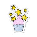 retro distressed sticker of a cartoon magical cupcake